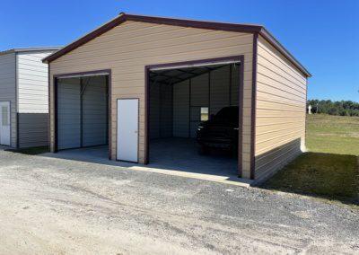 Exterior Of Two Car Metal Garage With Door In The Middle